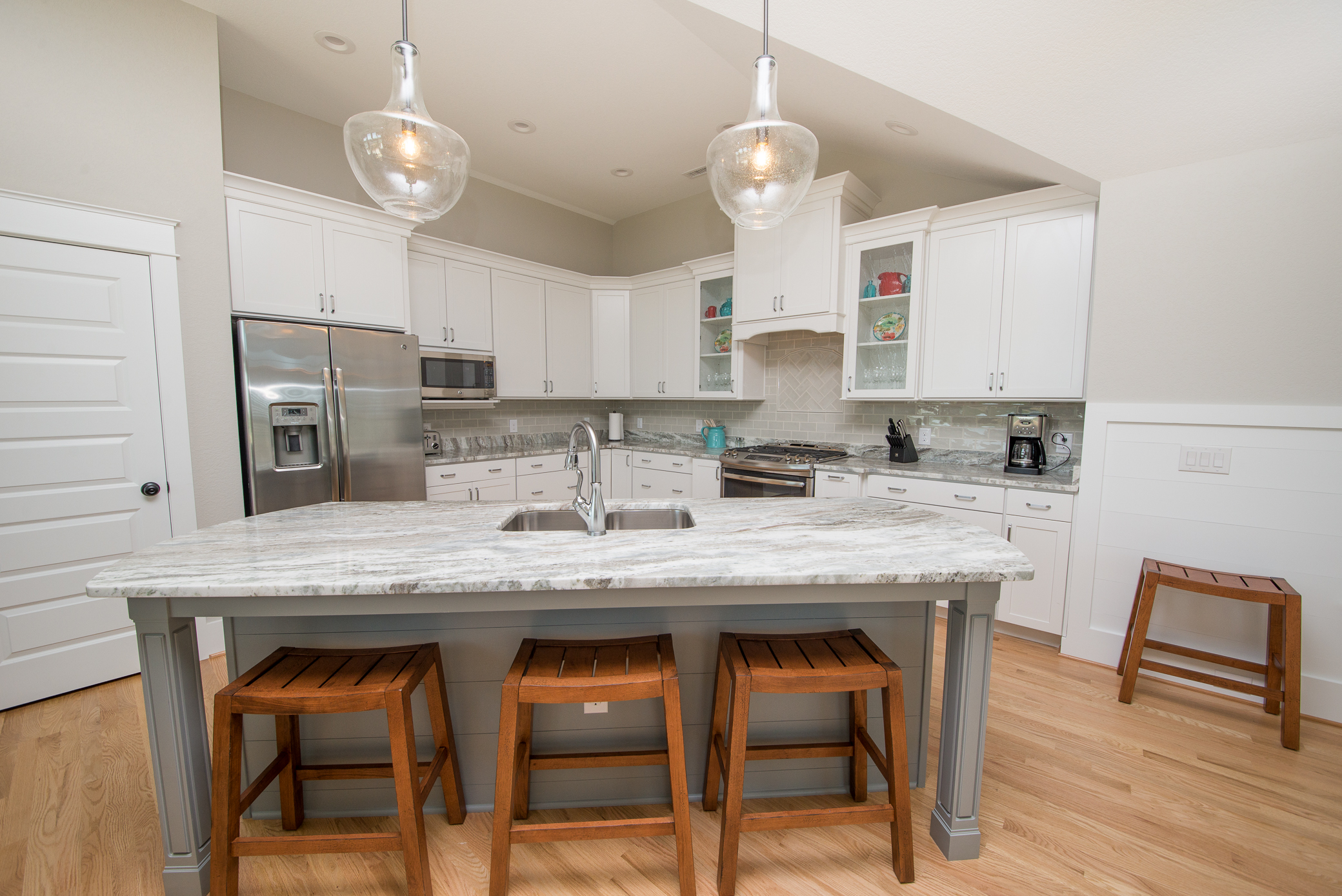 Stainless steel appliances, center island and granite countertops